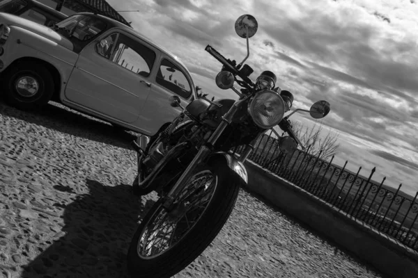 Black and white motorcycle, outdoors
