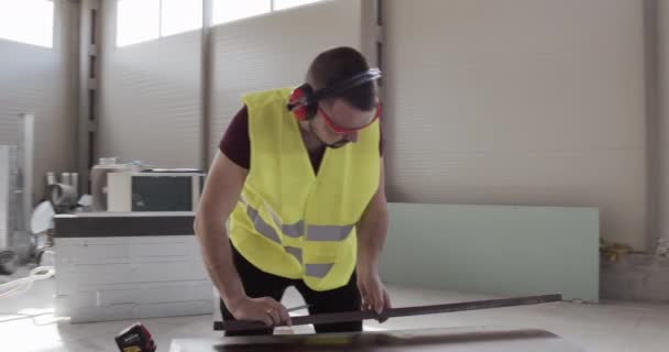 Man Construction Worker Makes Some Measurements Wants Start Working Investments — Stock Video
