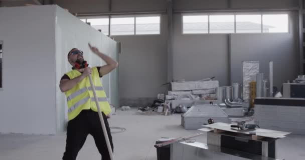 Cheerful Well Disposed Worker Dances Sweeper While Cleaning Deposit — Stock Video