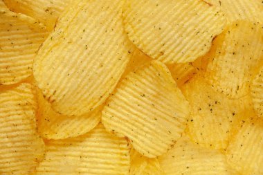 food background of fluted chips with dill