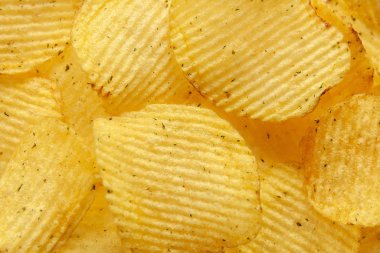 food background of fluted chips with dill