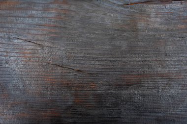 Siyah yanmış tahta. Yanmış ahşap doku