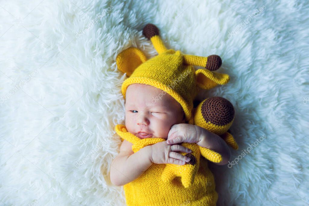 Pretty Newborn Baby Boy On Textile Background.
