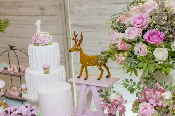 Luxurious table of sweets and birthday cake