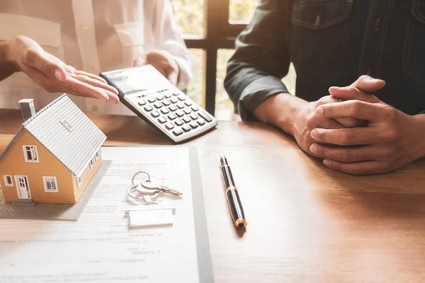 House model with agent and customer discussing for contract to buy, get insurance or loan real estate or property. — Stock Photo, Image