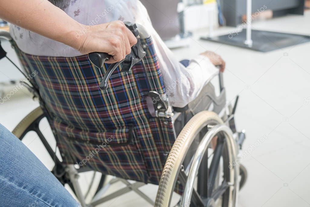 Senior woman on wheelchair in the hospital.