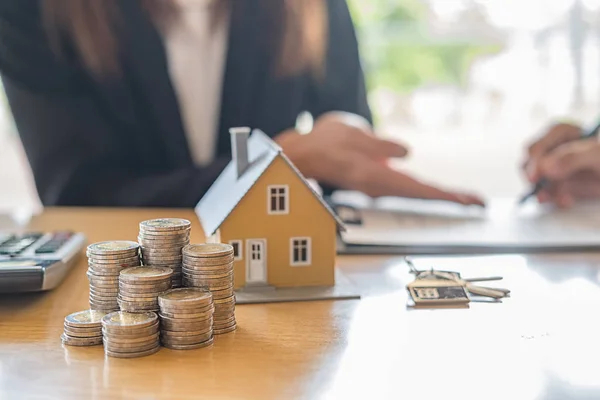 House model with agent and customer discussing for contract to buy, get insurance or loan real estate or property. — Stock Photo, Image