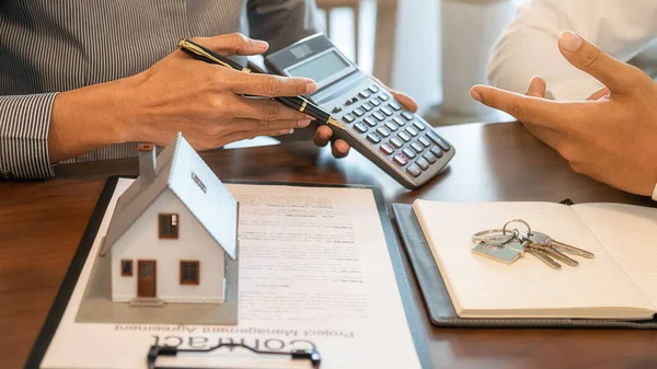 House model with agent and customer discussing for contract to buy, get insurance or loan real estate or property. — Stock Photo, Image