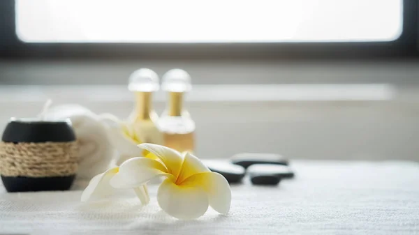 Spa treatment concept. Spa background with spa accessories on white bathroom background.