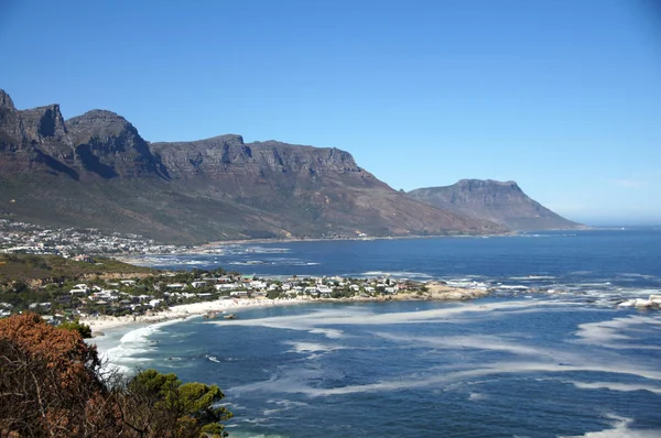 Camps bay in South Africa, Western Cape - yachts, ocean and mountain