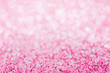 Kalp şeklindeki bokeh arkaplanlı pembe soyut arkaplan