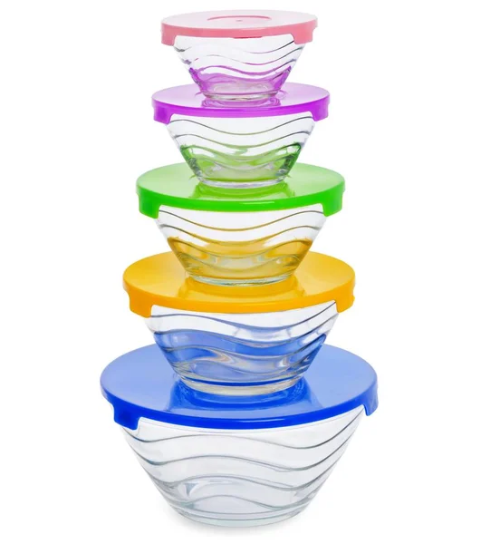 Pilha de recipientes de alimentos de vidro com tampa de plástico colorido isolat — Fotografia de Stock