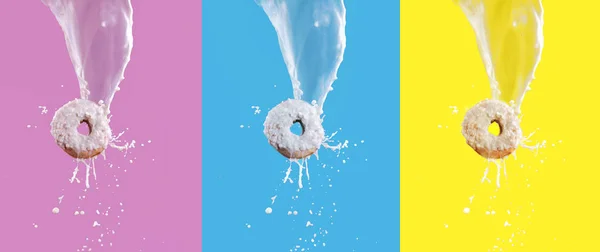 Flying doughnuts with white chocolate glazed and milk splashing isolated on pink, blue and yellow background. — Stock Photo, Image