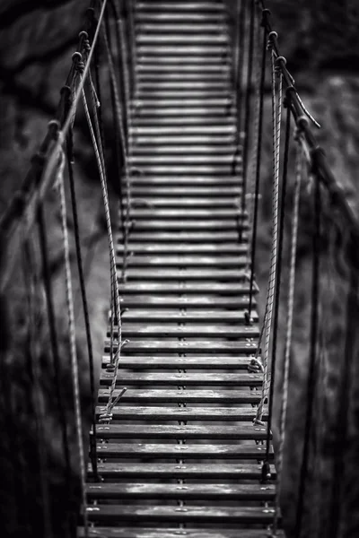 Suspension bridge in the mountains — Stock Photo, Image