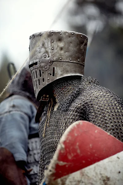 Knight in armor. Medieval battle (historical reconstruction)