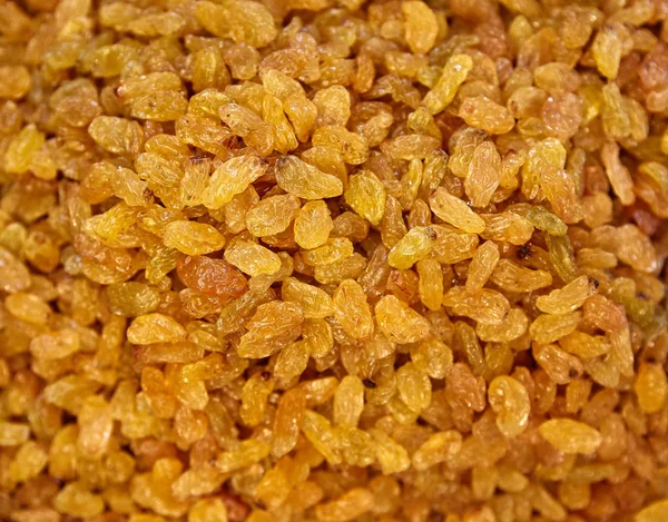 Antecedentes de pasas. Sultanas amarillas. Uva sin semillas secas doradas — Foto de Stock