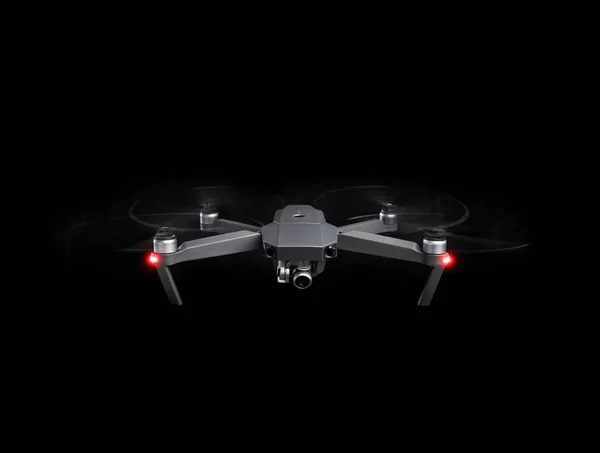 Dron - létání ve tmě, na černém pozadí. — Stock fotografie