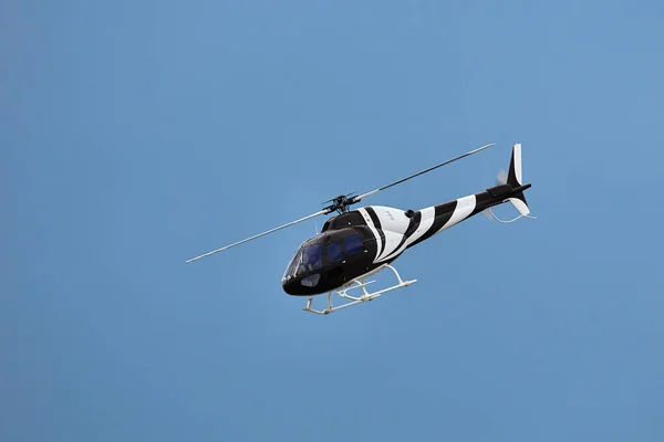 Radio controlled model helicopter in flight