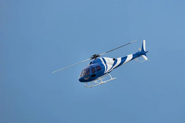 Radio controlled model helicopter in flight