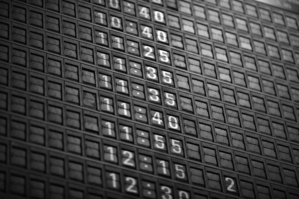 Time boards at the airport. Flight information mechanical timetable. Split flap mechanical departures board. Flight schedule