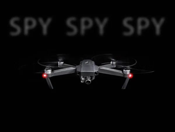 Drone spy. Drone - Flying in the dark, on black background