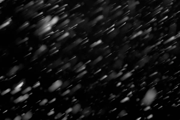 黒い背景のデザイン要素に降雪 — ストック写真