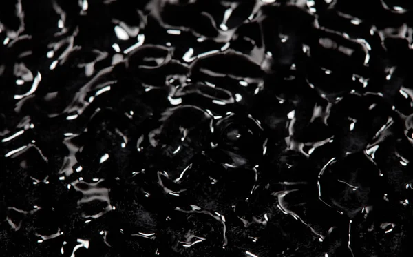 Textura líquida de fundo preto abstrato — Fotografia de Stock