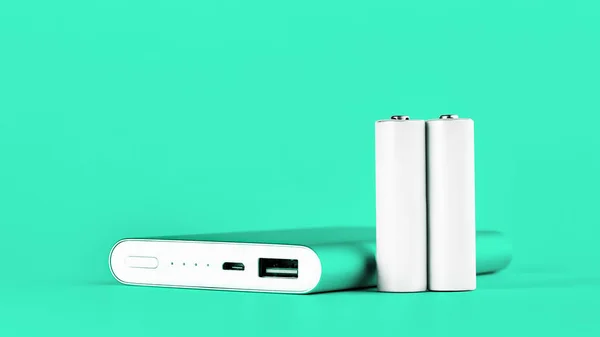 Portable green power bank for charging mobile devices and AA batteries. — Stock Photo, Image