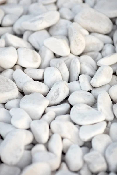 Naturally polished white rock pebbles background. white stones in design — Stock Photo, Image