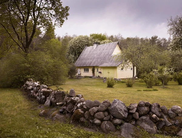 Kunda, Viru-Nigula, Estonia - May, 20 2019: An estate house in estonian countryside. Shot on a summer day. Idyllic view. No one, background