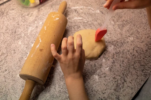 Child shaping and cutting baking cookies for christmas — Stock Photo, Image