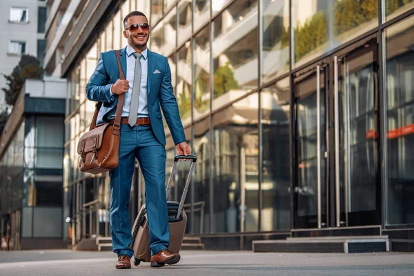 Young businessmen at international airport moving to terminal gate for airplane travel.Business and travel concept.Business trip.