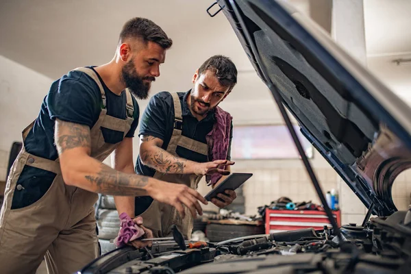 Two Mechanics Uniform Working Auto Service Transmission Checking Repairing Teamwork — Stock Photo, Image