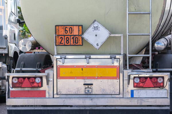 Tank truck of dangerous goods with their orange plates and toxic danger label