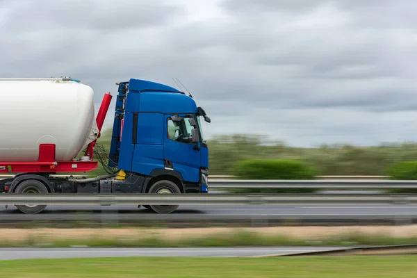 Truck driving on the highway, with stopped truck effect and moving landscape