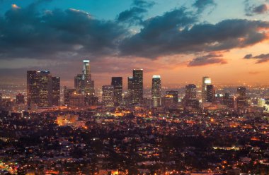 Los Angeles Downtown at Dusk in front of a Dramatic Sunset Sky clipart