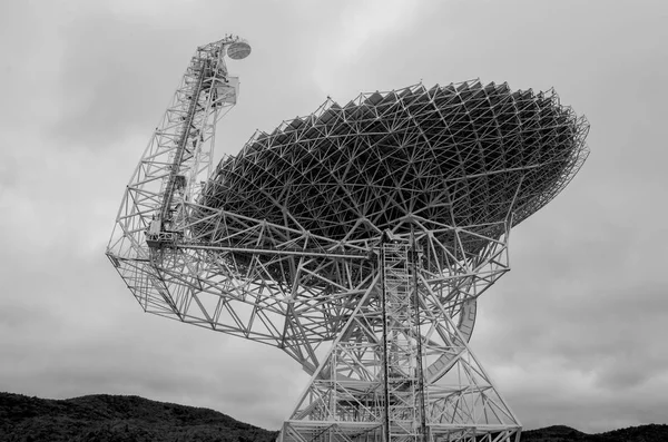 A giant radio telescope listens to signals from the stars