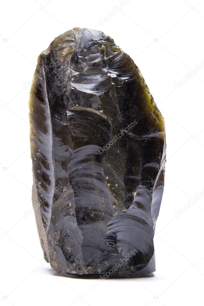 A knapped blade made from rare green obsidian that is only found in Central America, isolated on white