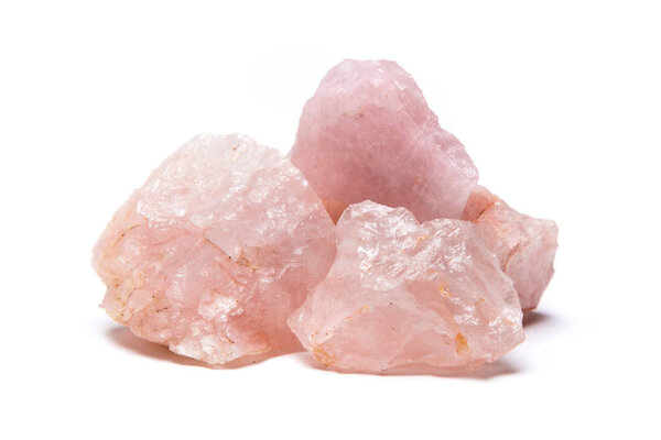 Rare and beautiful raw rose quartz samples isolated on white