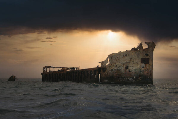 The famous and mysterious Sapona Shipwreck in the Bermuda Traingle of the Caribbean Sea in front of a dramatic sunset