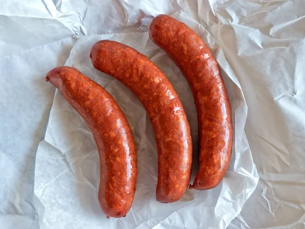 Freshly Made Sausage Links Just Unwrapped Butcher Paper — Stock Photo, Image