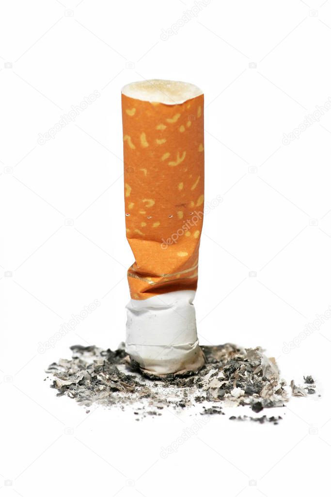A stamped out cigarette butt isolated on white