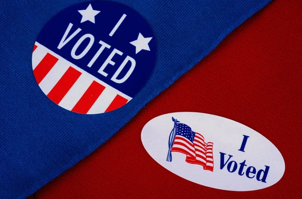 "I Voted" Voter Sticker Given At The Election Polls, on Red and Blue Background — стокове фото