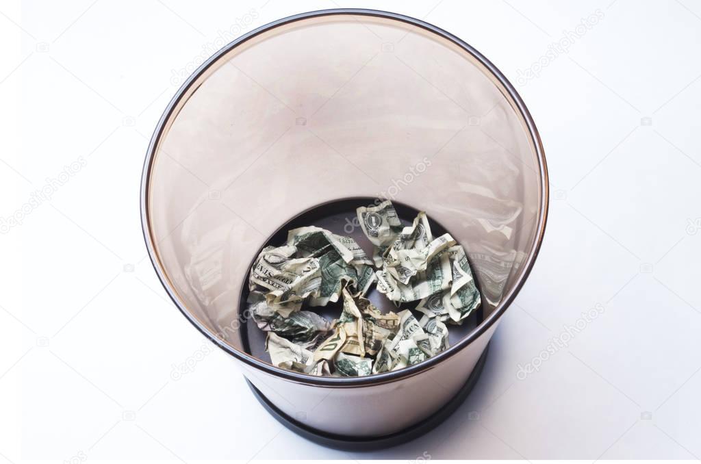 Money Wasted In A Wastebasket