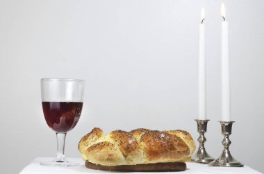 Shabbat Candles,Challah, And Glass Of Wine clipart
