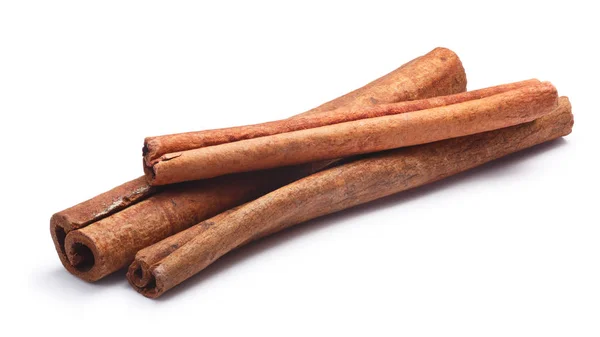 Pile of cinnamon sticks, paths — Stock Photo, Image