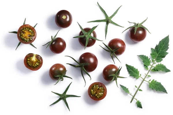 Tondo nero tomates cherry, caminos, vista superior — Foto de Stock