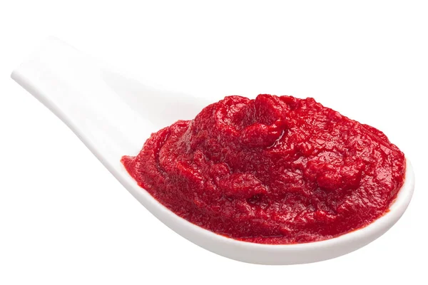 Spoonful of tomato paste or puree — Stock Photo, Image