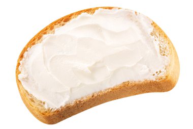Yumuşak krem peynirli ekmek dilimi izole edilmiş, üst manzara.