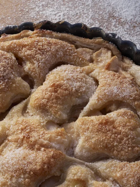 A puff pastry covered lightly sugared apple tart